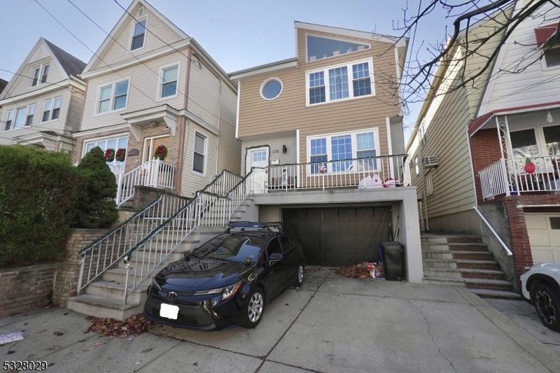 a front view of a house with parking