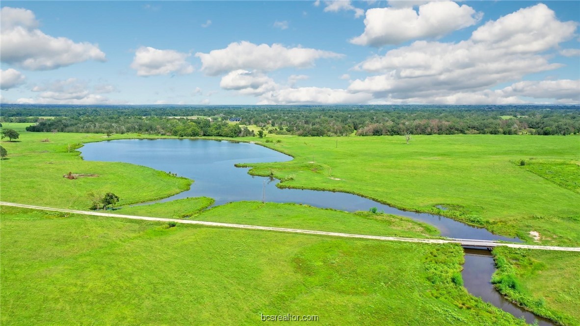 a view of a golf course with a lake