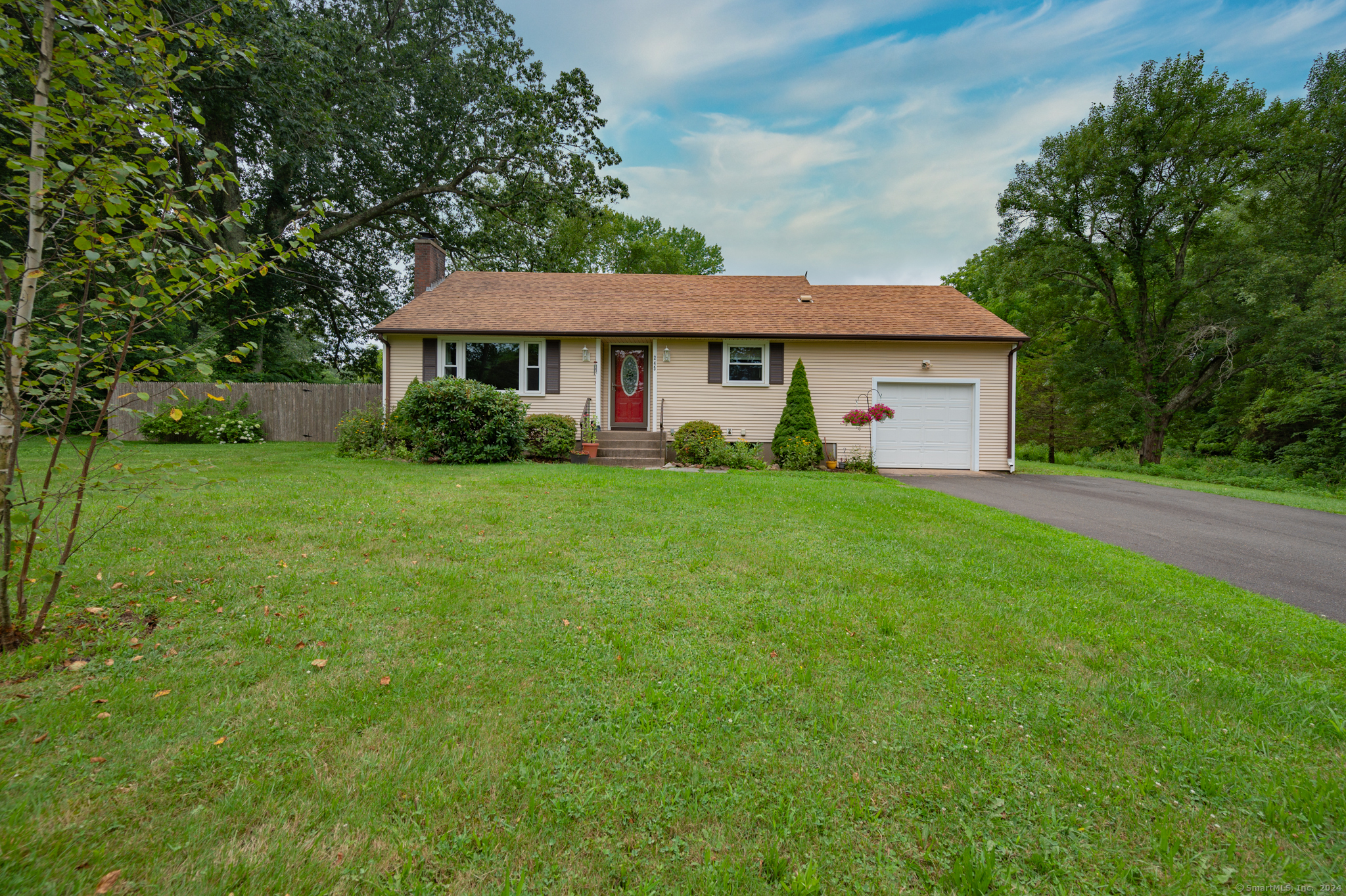 a view of a house with a yard