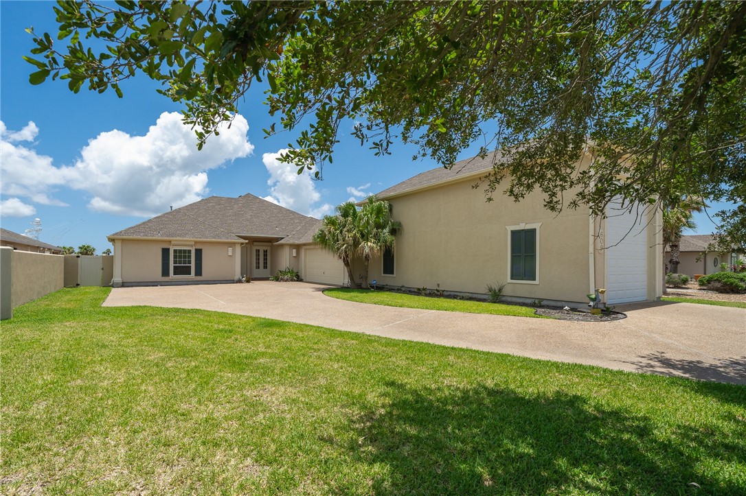 a view of a house with a yard