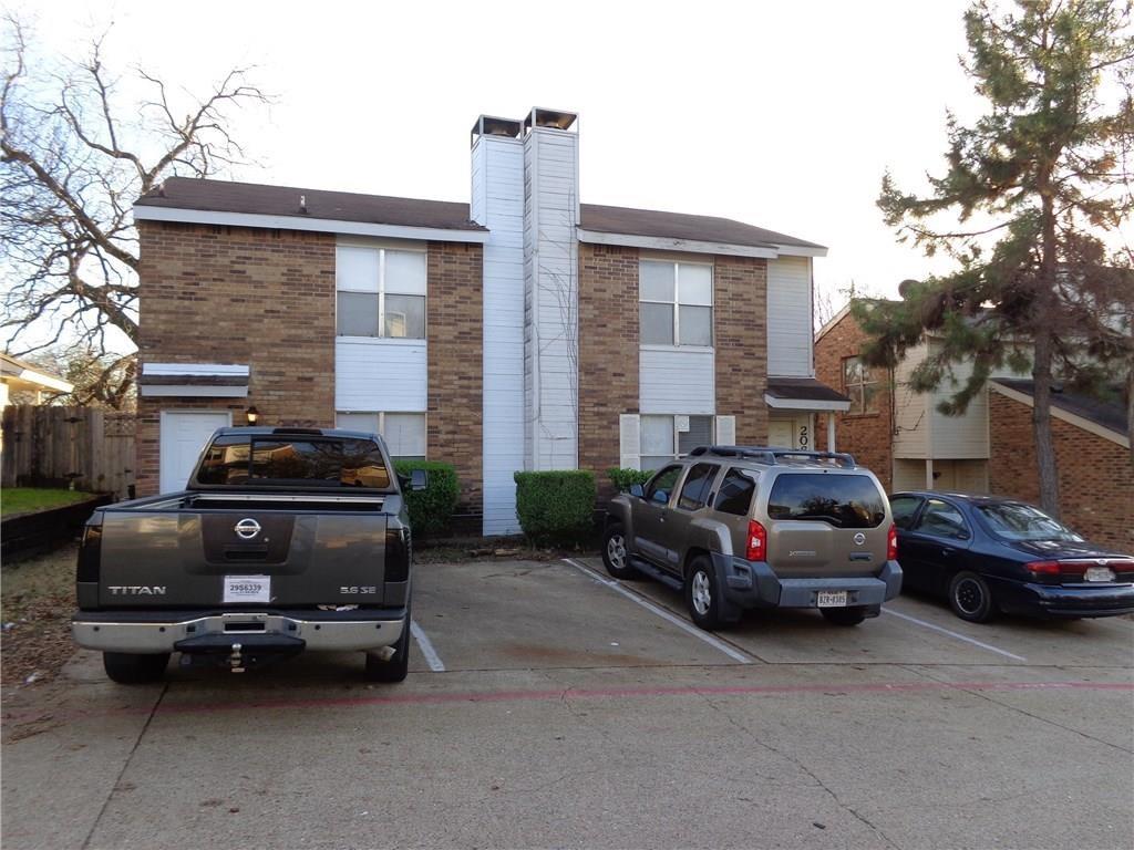 a car parked in front of a house