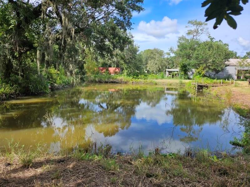 a view of a lake with a big yard