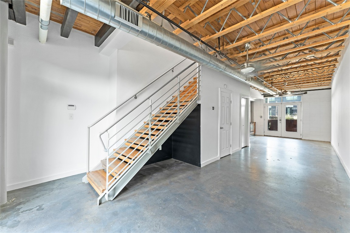 a view of an empty room with stairs