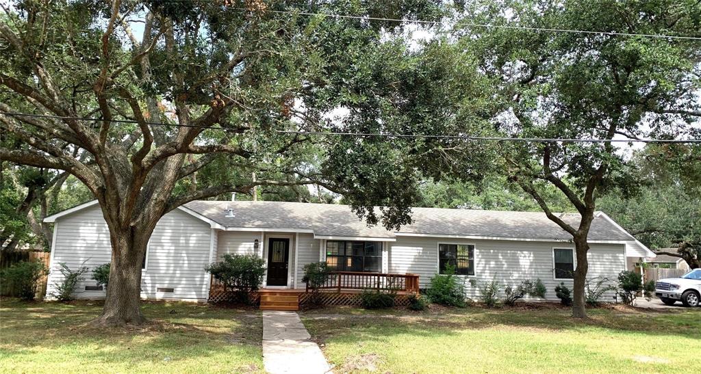 a front view of a house with a yard table and chairs