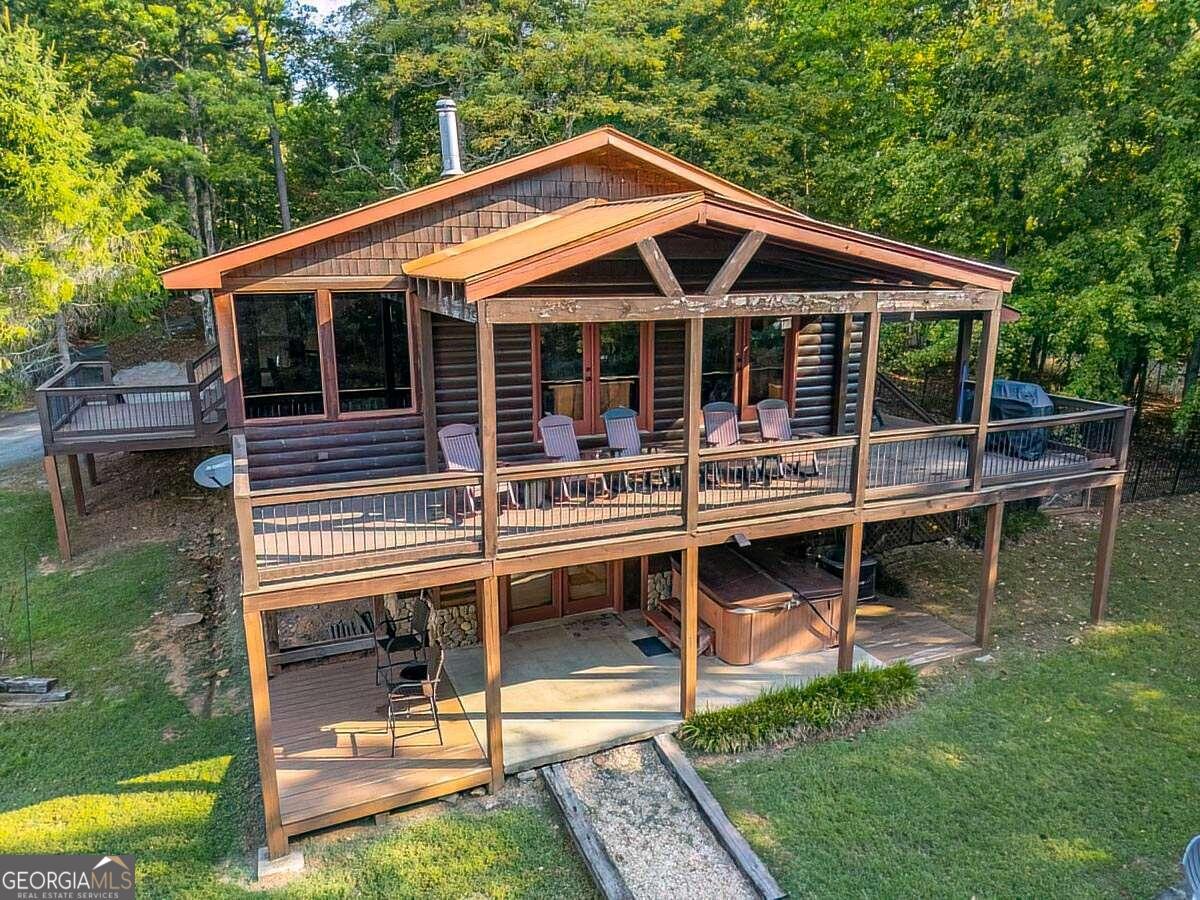 a backyard of a house with table and chairs