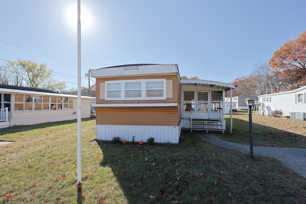 a view of a house with a backyard