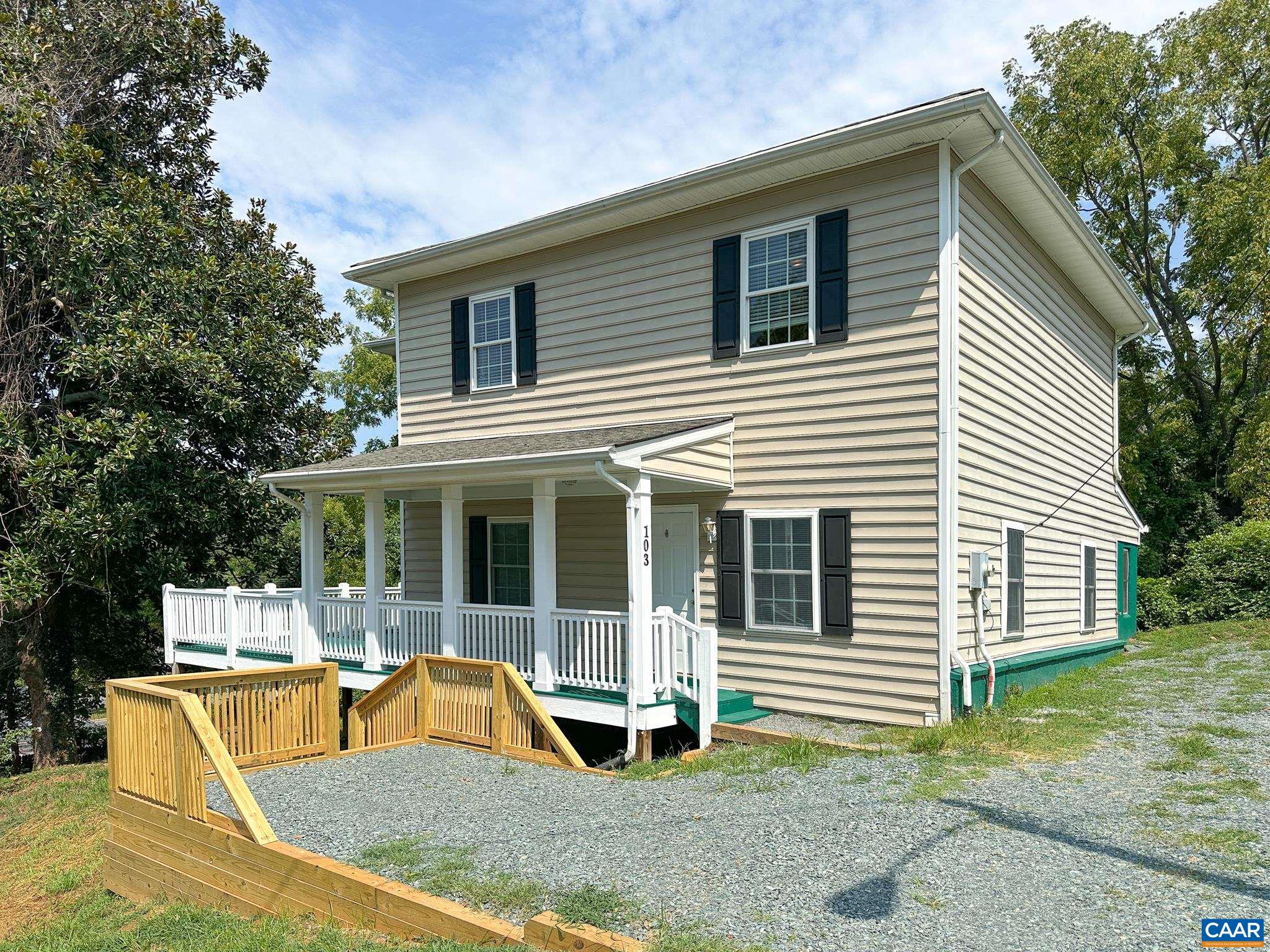 a house view with a outdoor seating