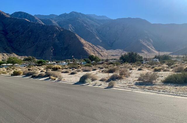 a view of a street with a mountain