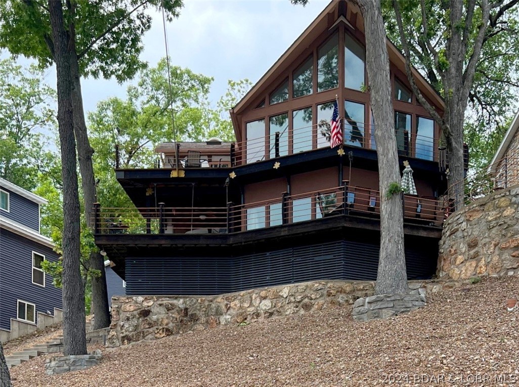Lake Front Home with multiple decks, walkways, pat