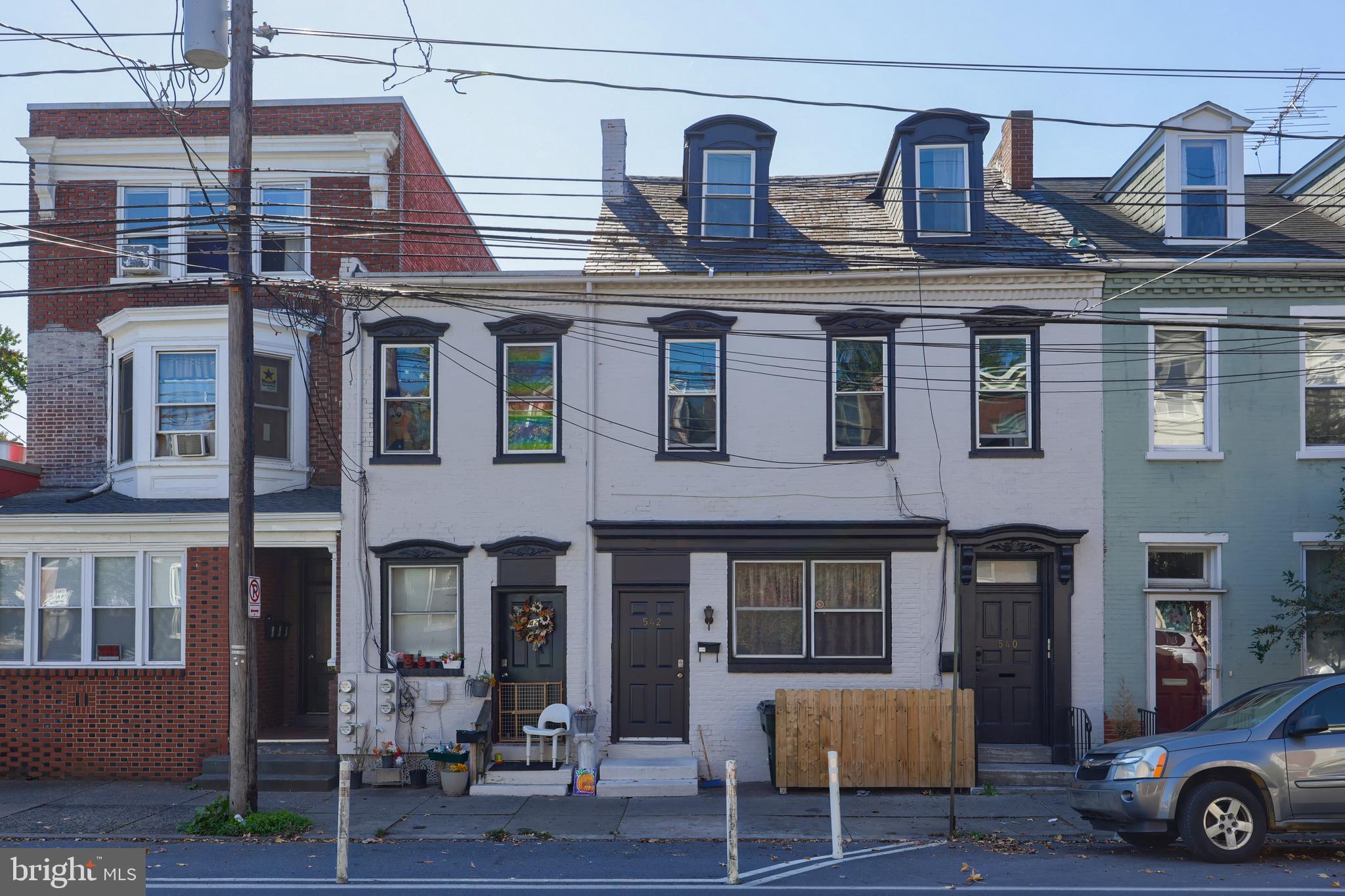 a view of a brick building with many windows