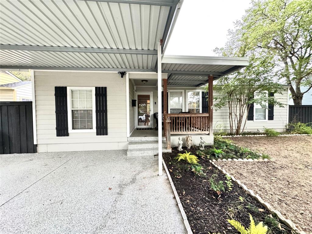 a front view of a house with a wooden fence