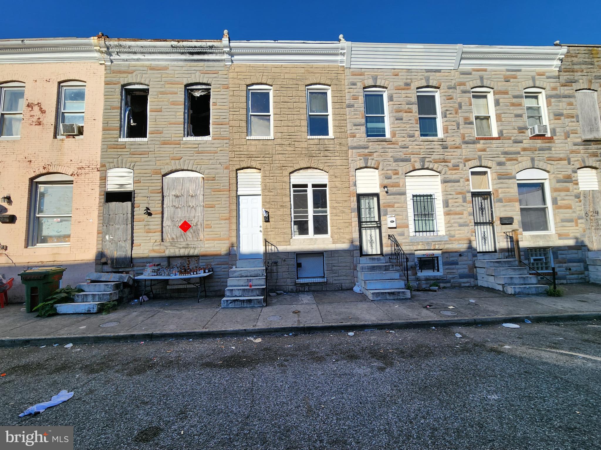 a front view of a house with many windows