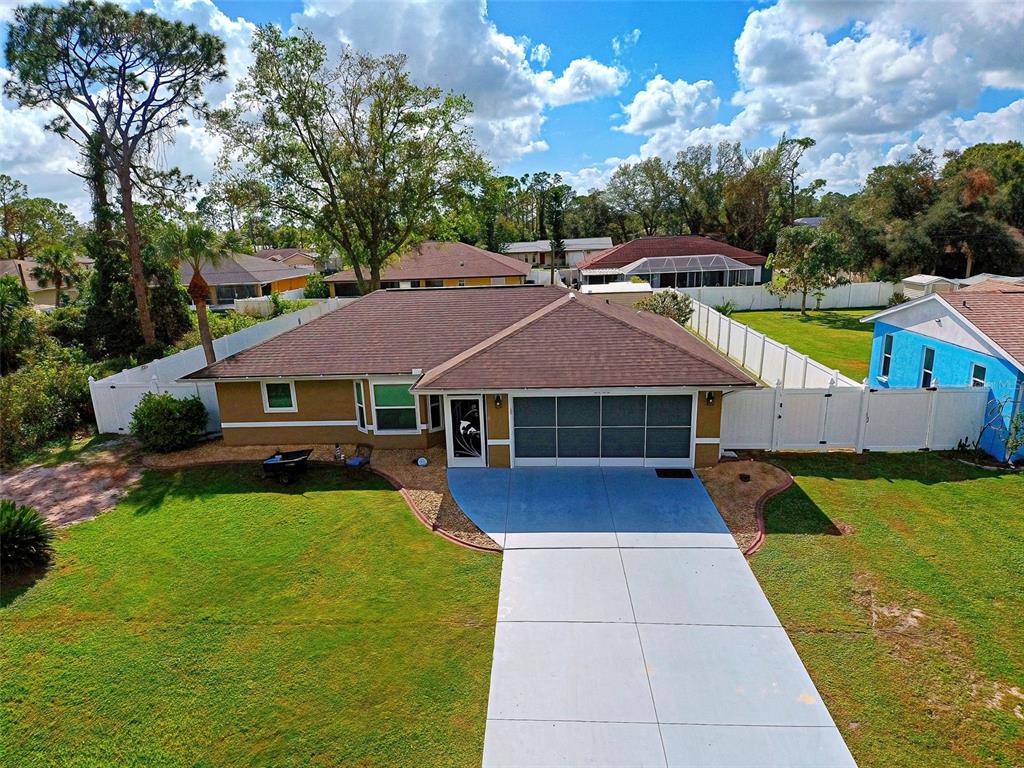 a front view of house with yard and swimming pool