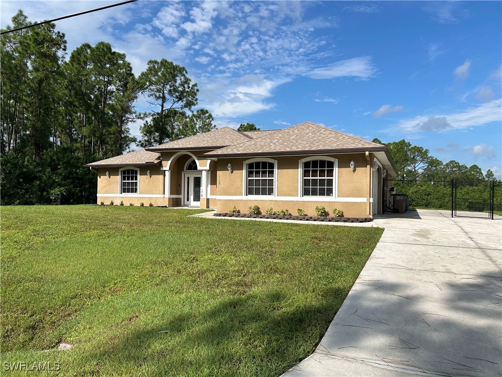 a front view of a house with yard