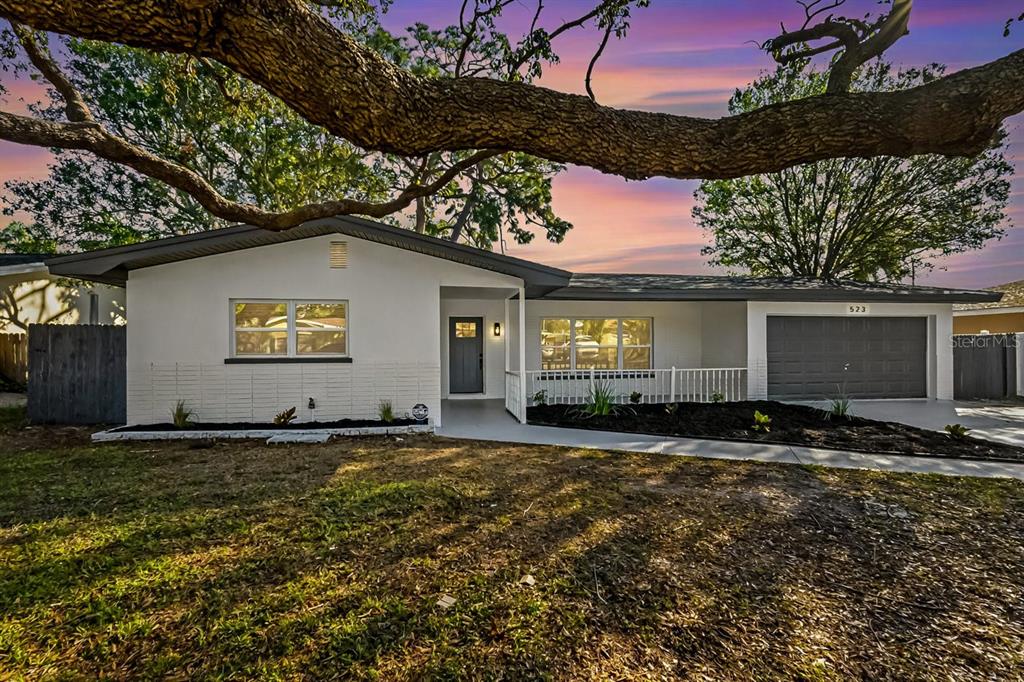 a view of a house with a yard