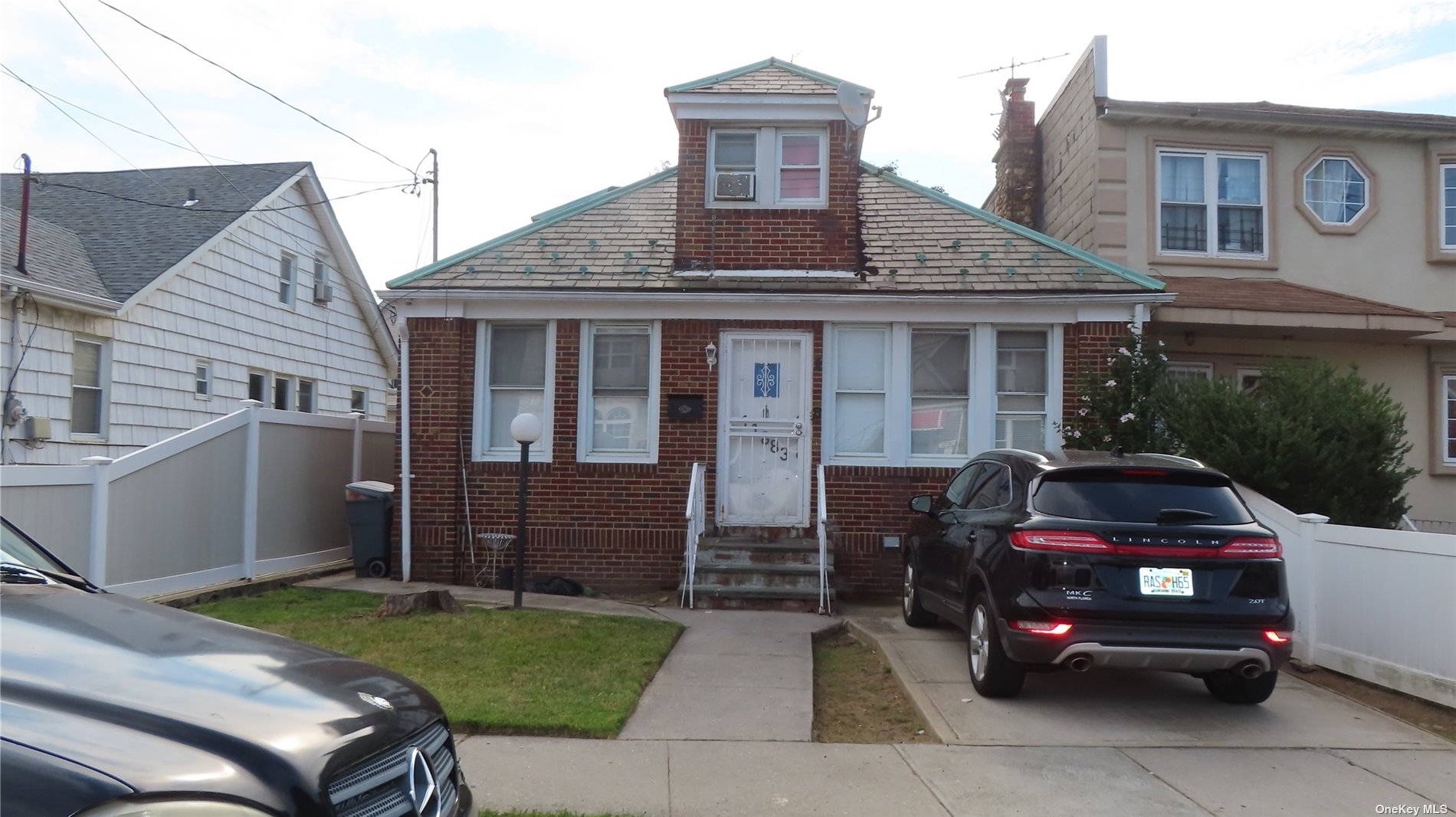 a car parked in front of a house