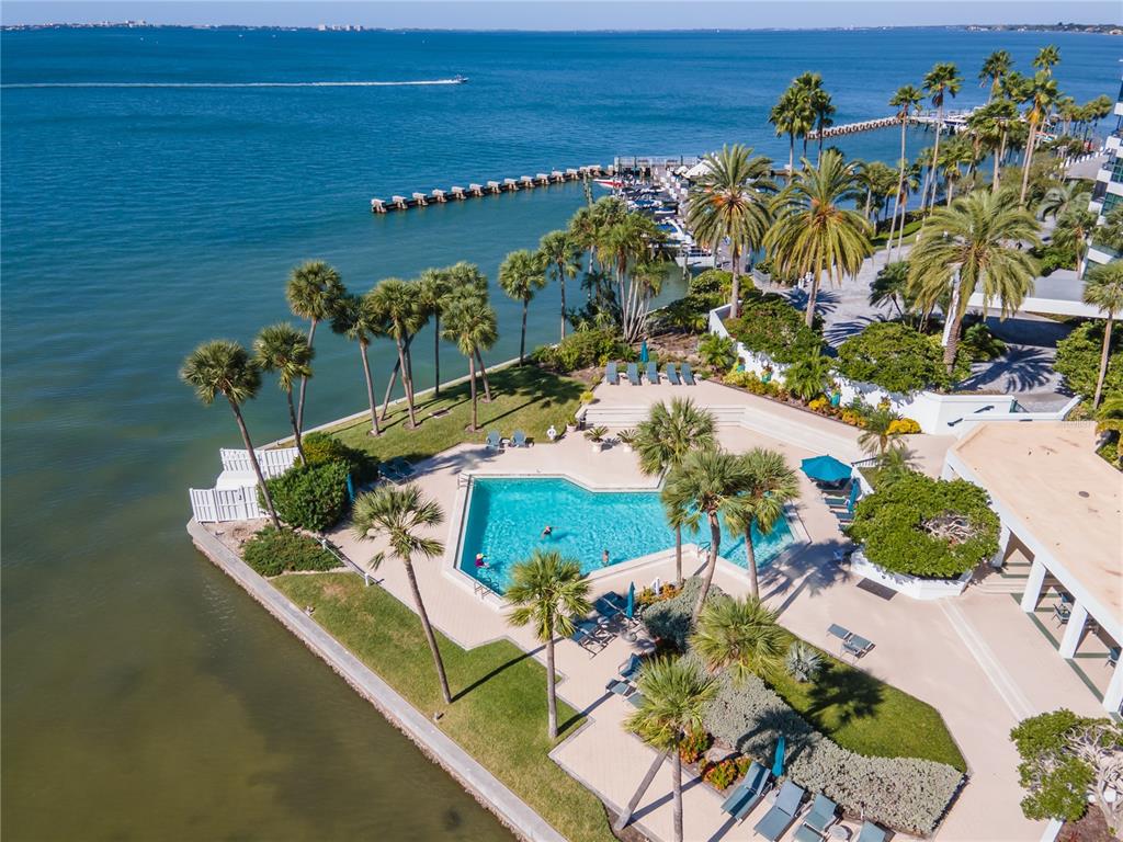 an aerial view of a house a yard and lake view