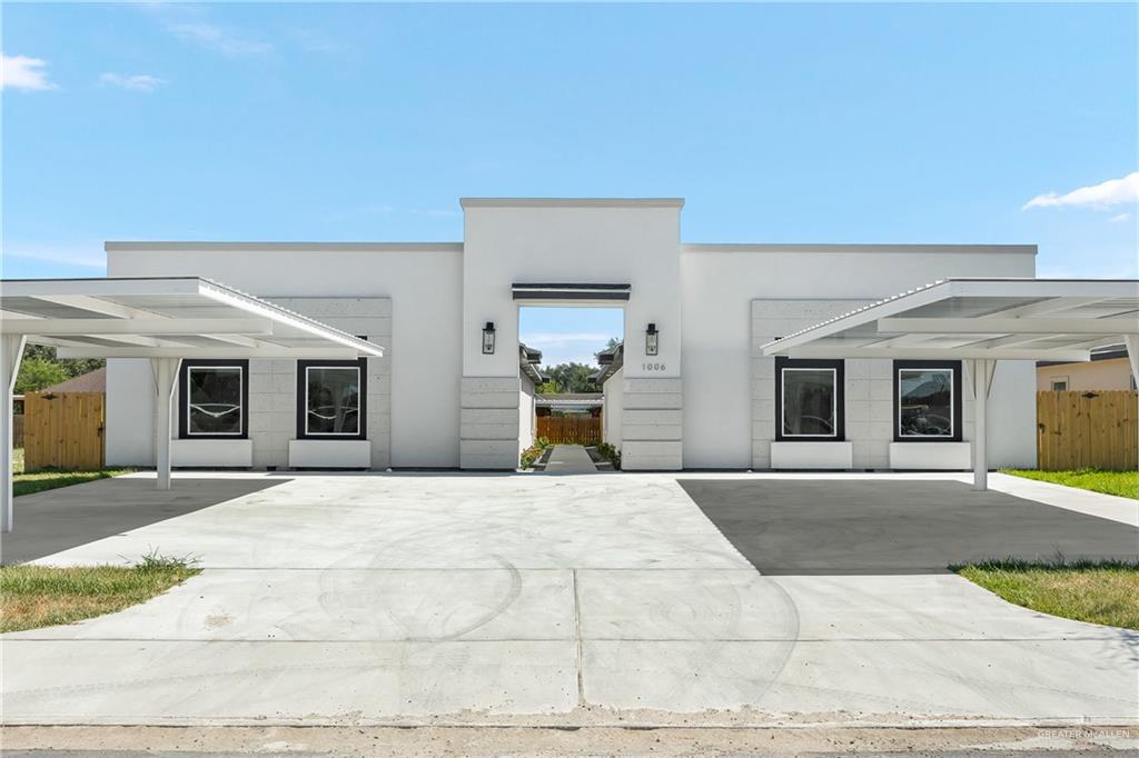 View of front of house featuring a carport