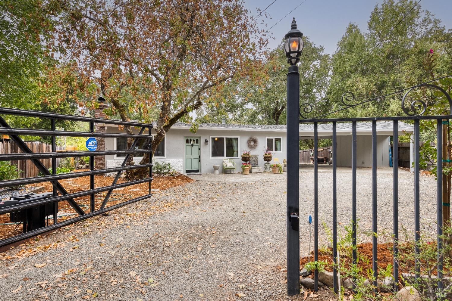 Front entrance with ample parking and motorized gate with key pad entry.