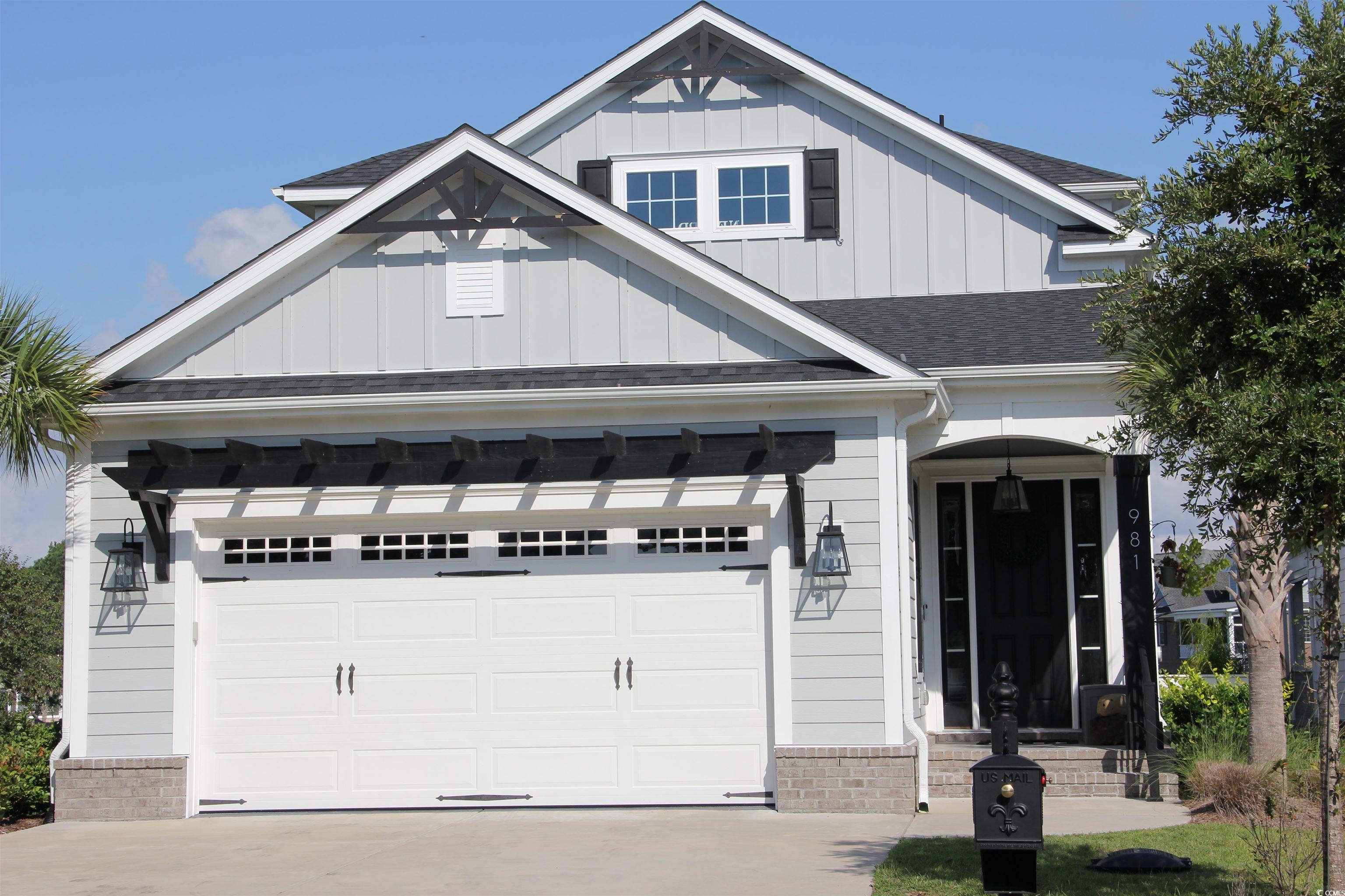 Craftsman house with a garage