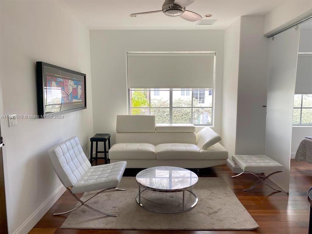 a living room with furniture and a window