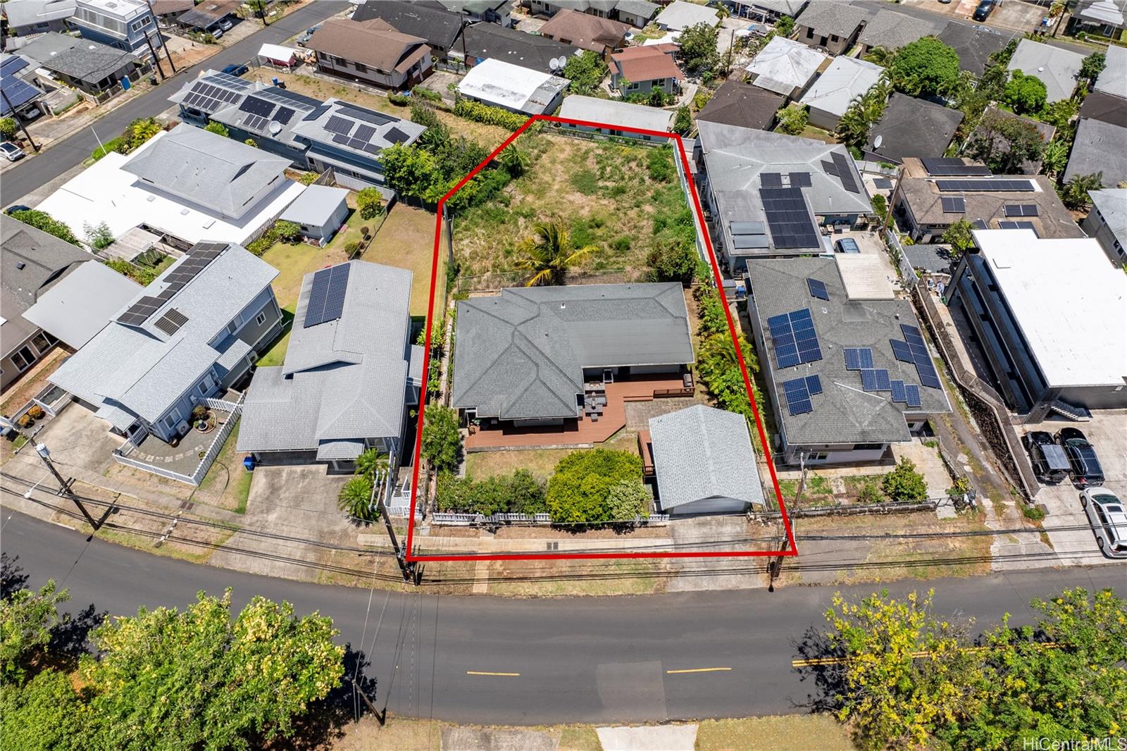 an aerial view of residential houses with street