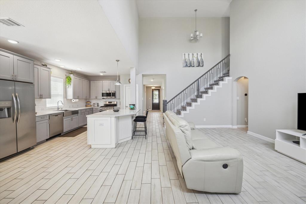 a view of kitchen with furniture and wooden floor