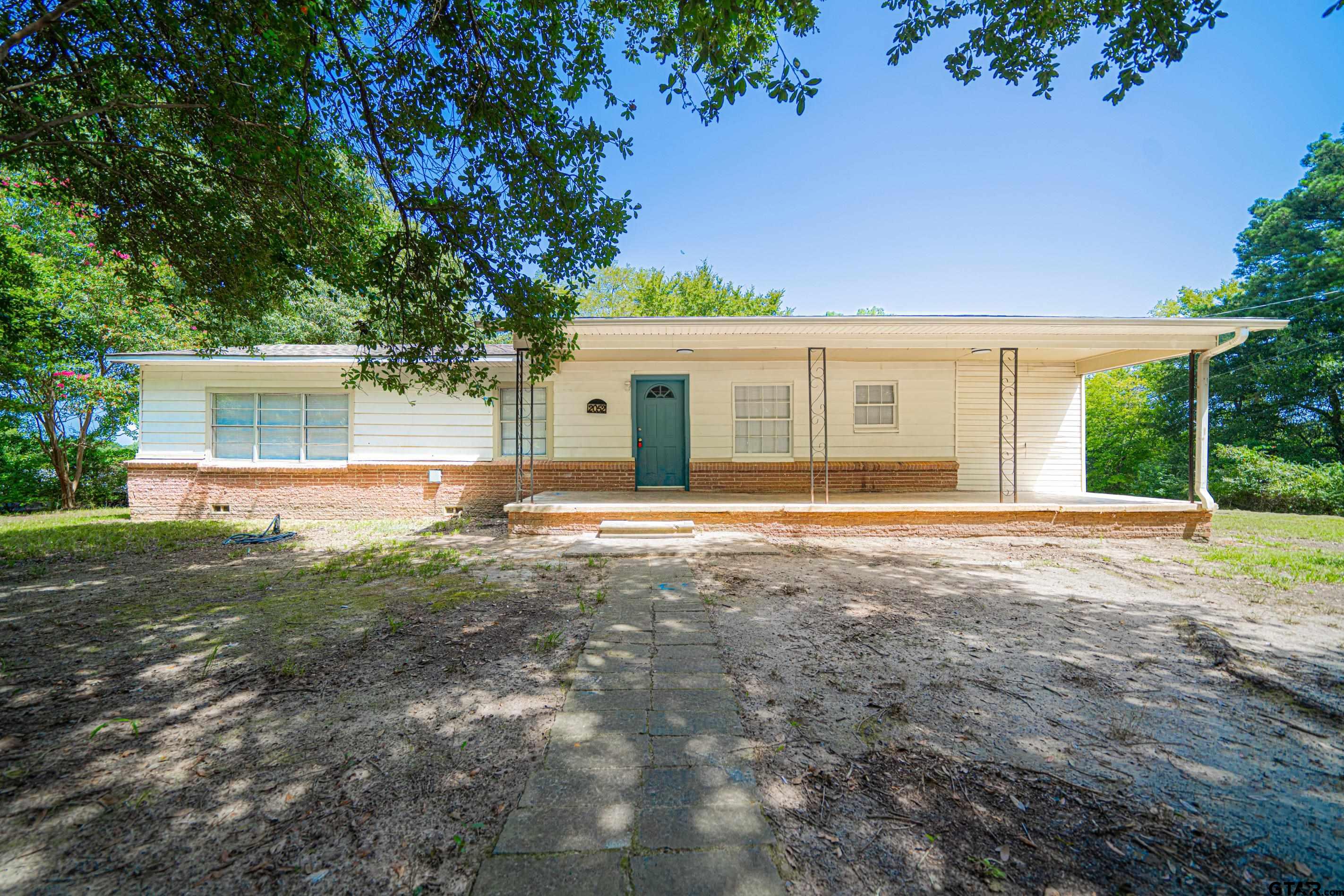 front view of a house with a yard