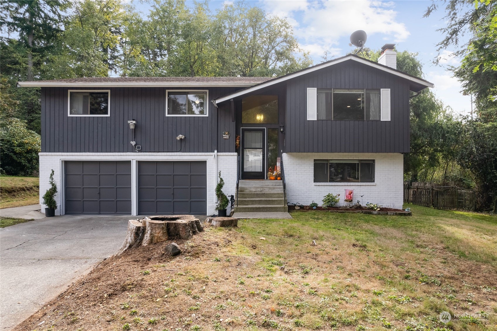 a front view of a house with a yard