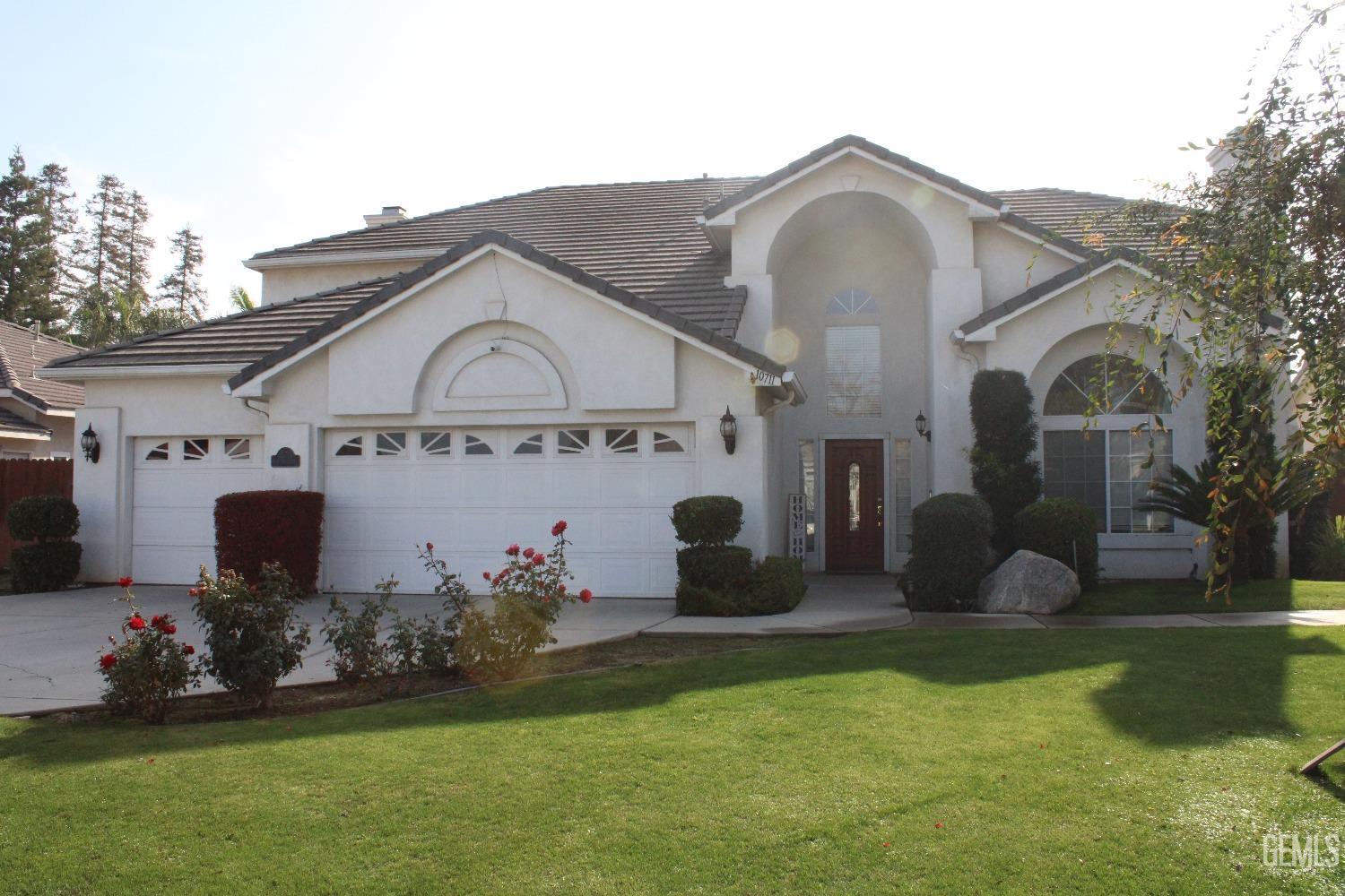 a front view of house with garden