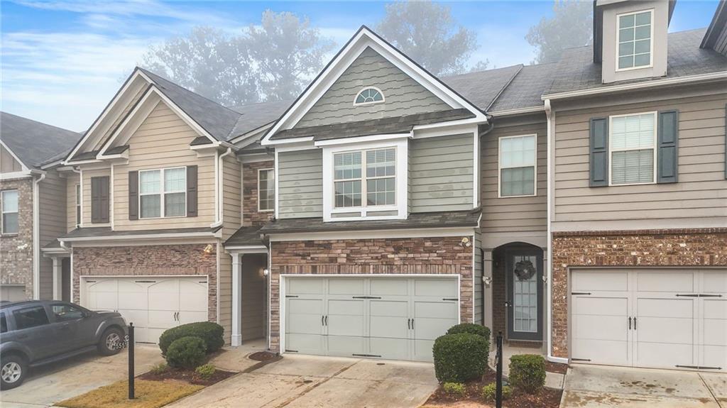 a front view of a house with a garage