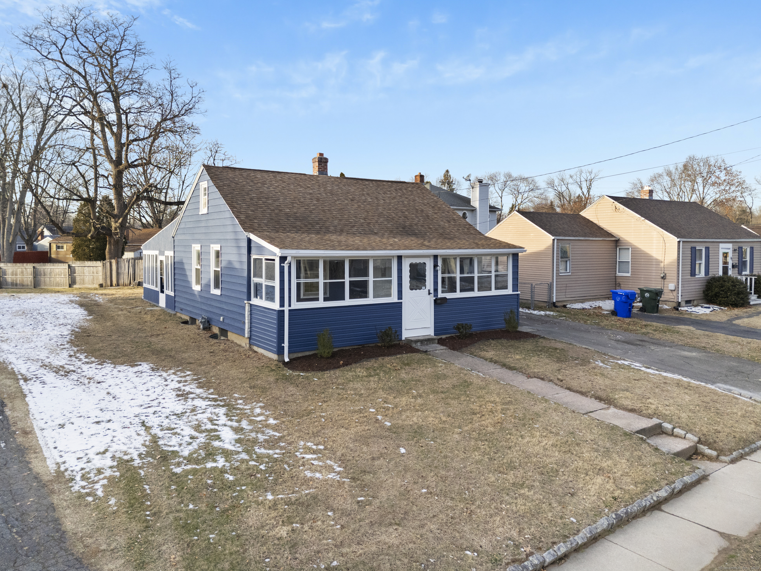 a view of house with a yard