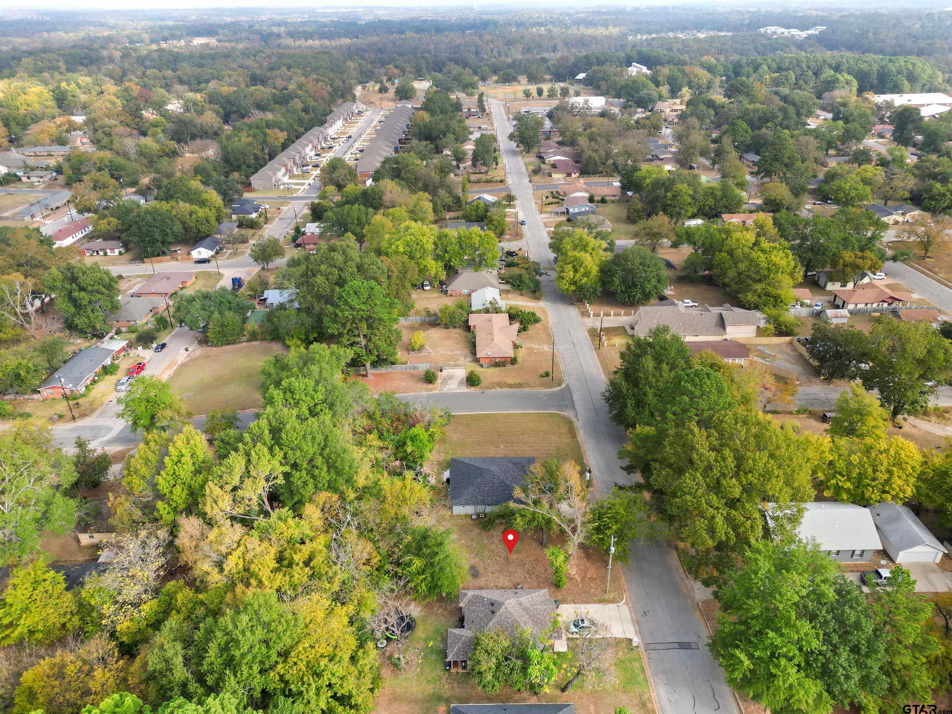 an aerial view of a city with lots of residential buildings