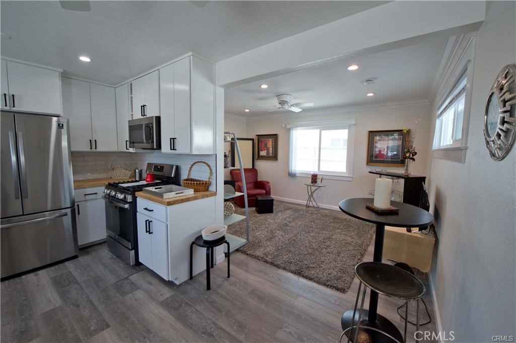 a kitchen with a refrigerator and a sink