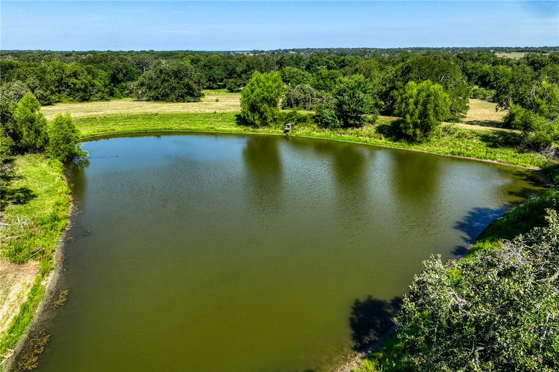 a view of a lake with a yard