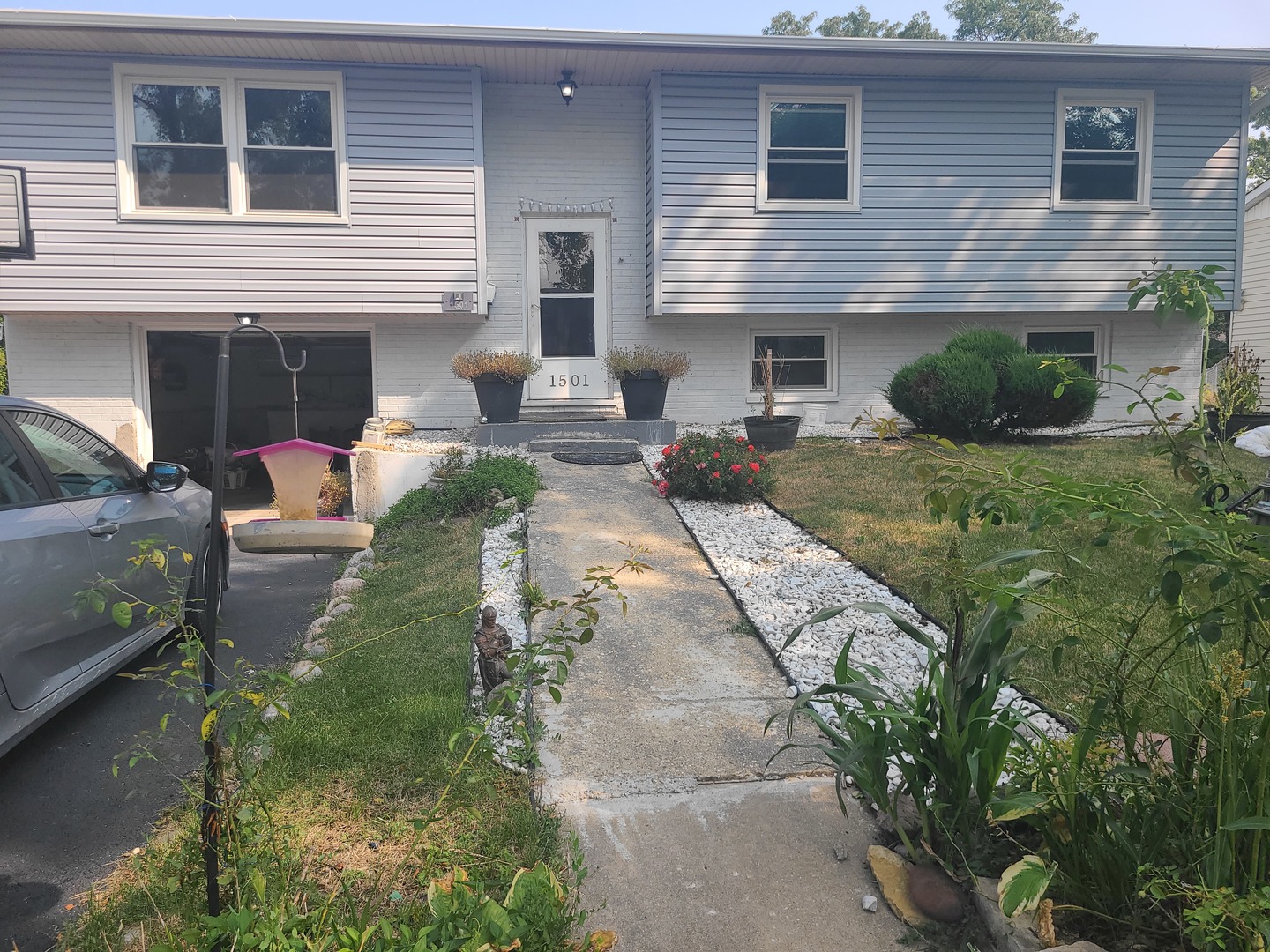 a front view of a house with garden