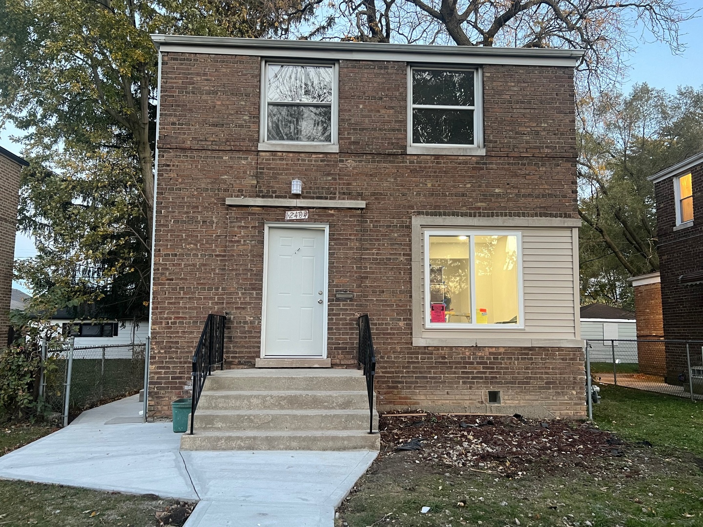 a front view of a house with garage