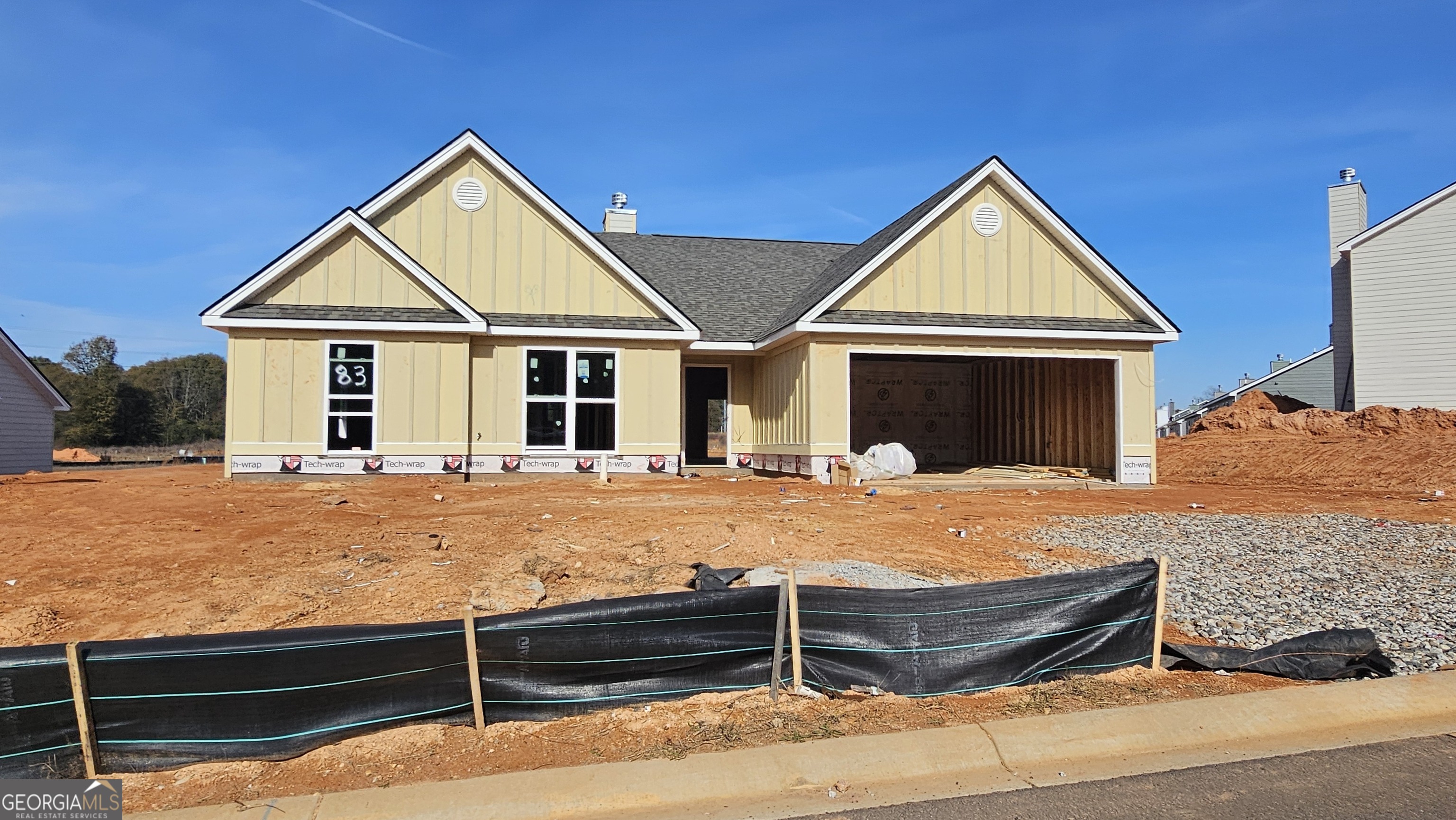 a front view of a house with yard