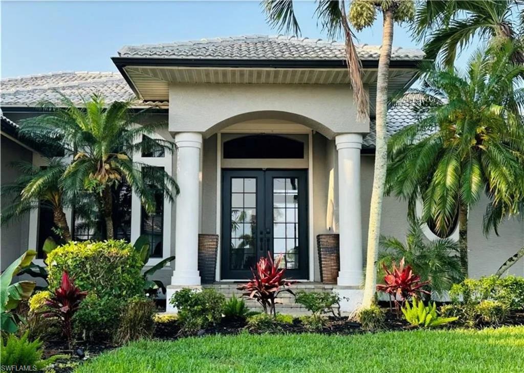 Property entrance featuring french doors