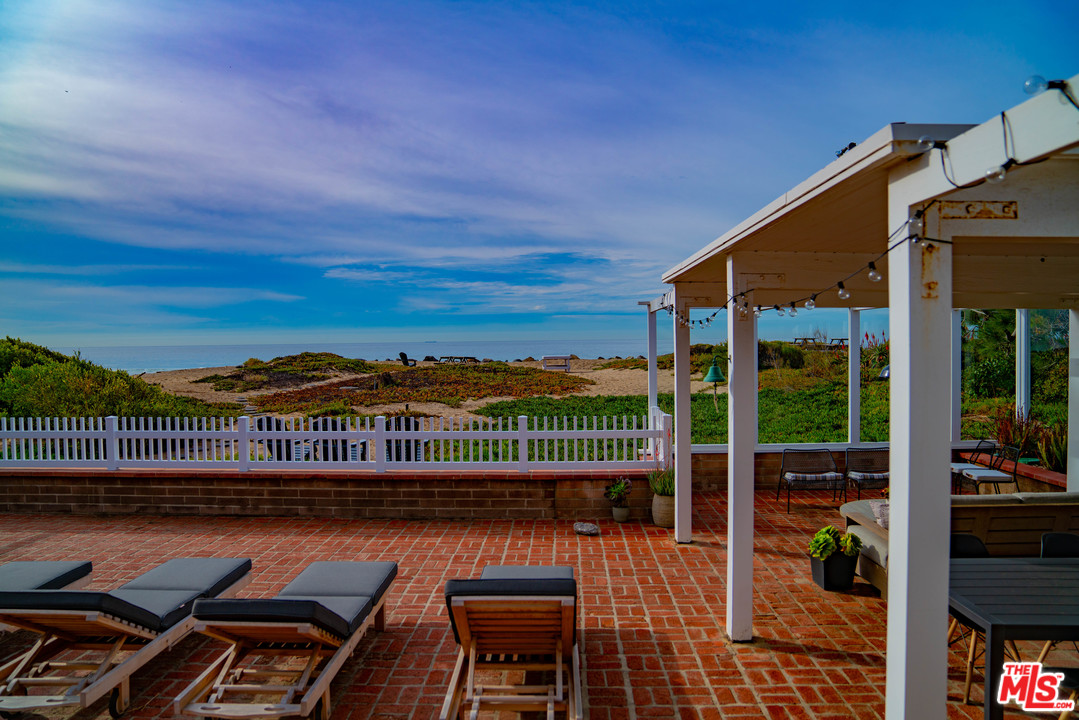 a view of a balcony with lake view and a floor to ceiling window