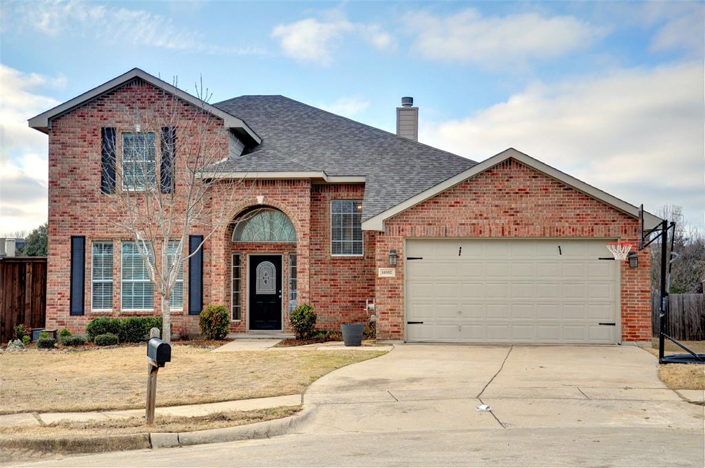 a front view of a house with yard