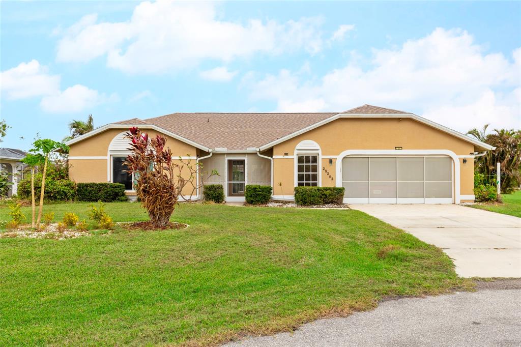 a front view of house with yard and green space