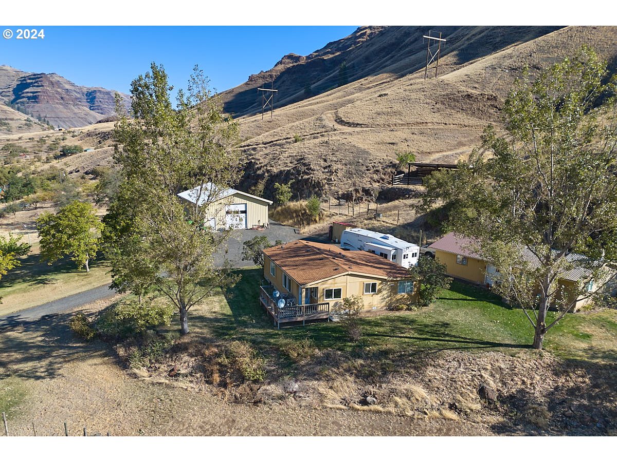 a aerial view of a house with a yard