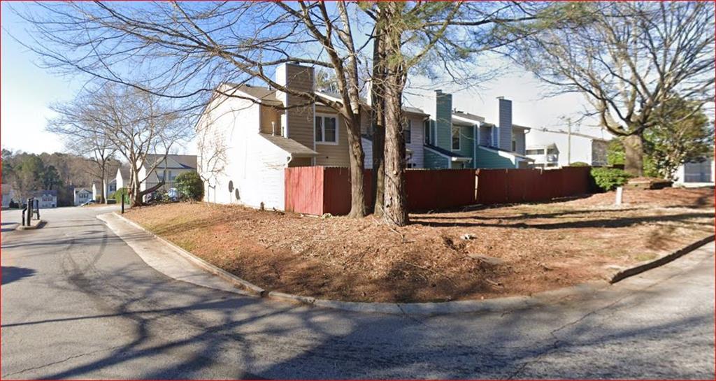 a street view with yard covered in snow