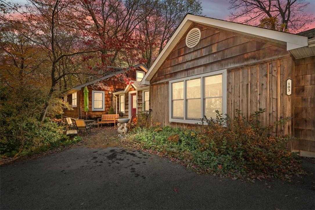 View of property exterior at dusk