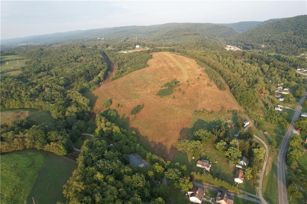 an aerial view of a house with a lake view