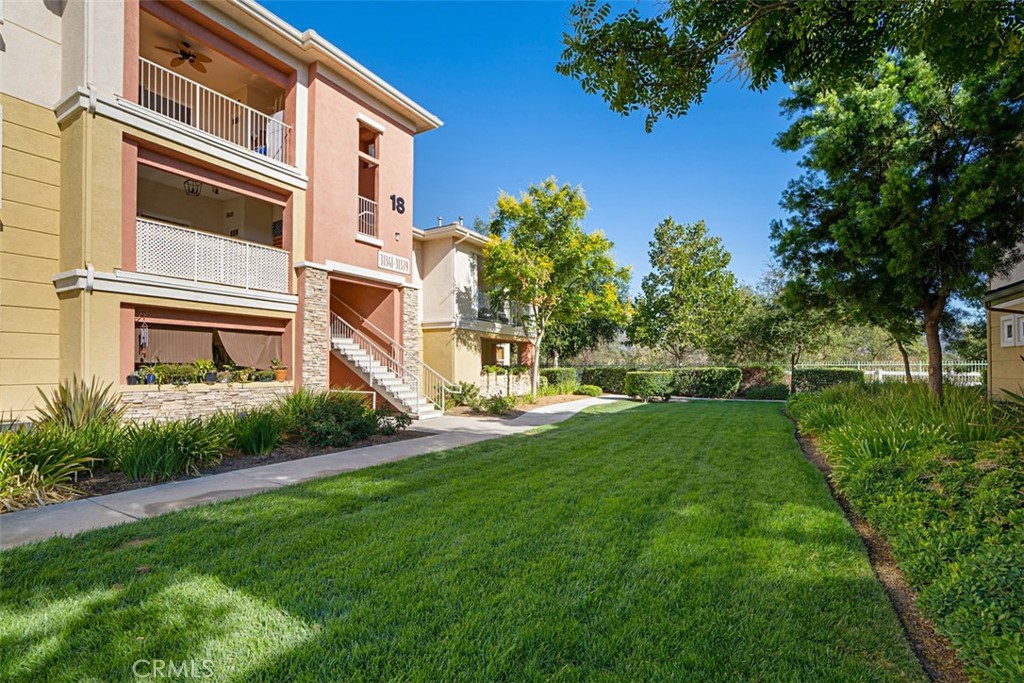 a view of a building with a yard