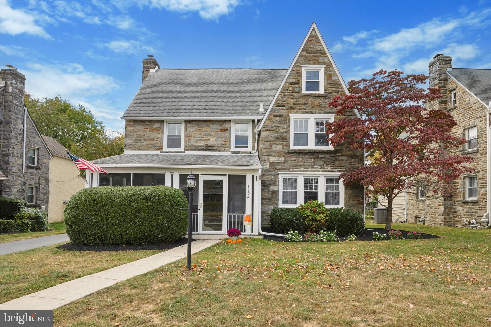 a view of a brick house with a yard