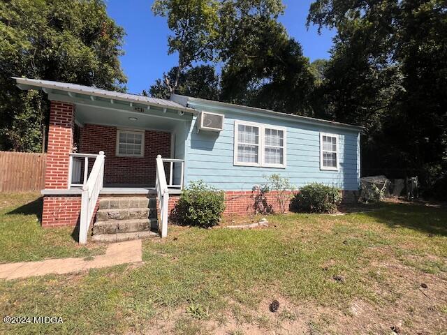 front view of a house with a yard