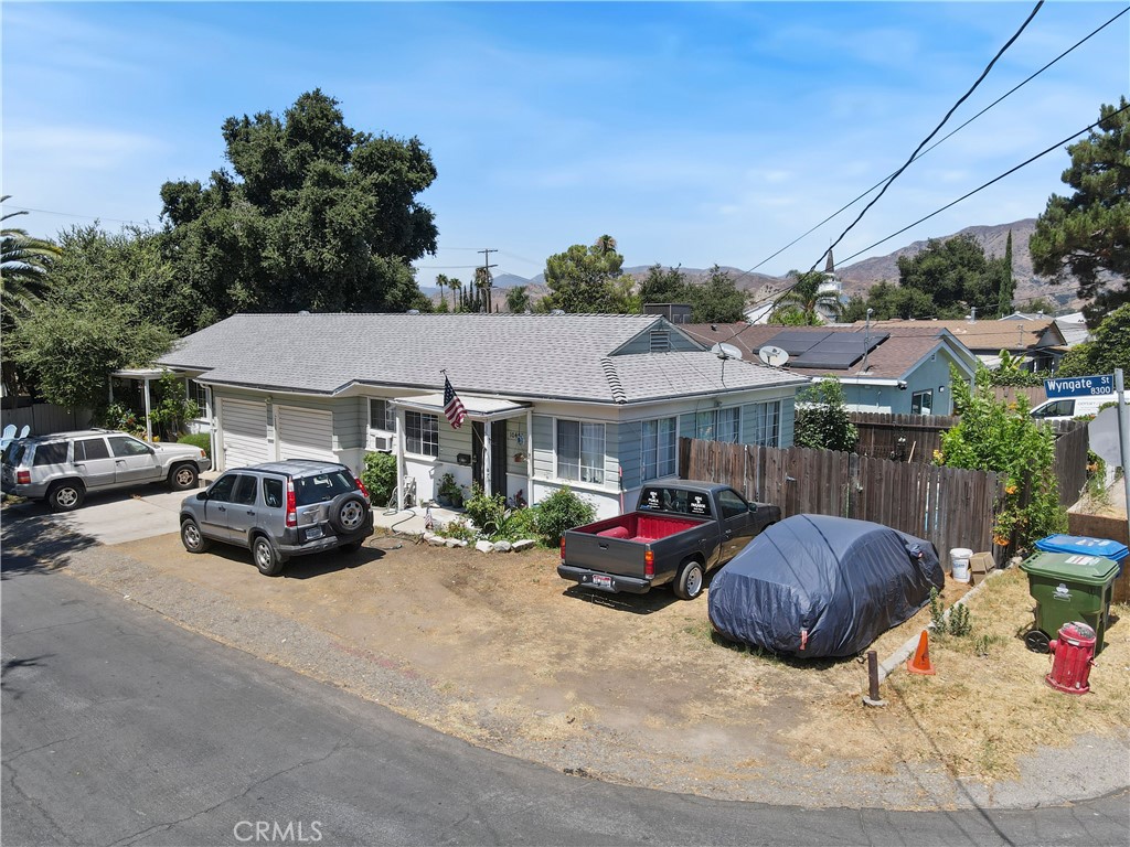 a view of a cars parked in front of a house